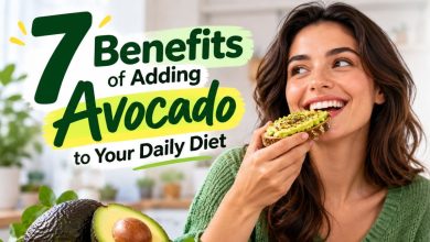 Woman eating avocado toast with fresh avocados, highlighting 7 benefits of adding avocado to your daily diet, including heart health, brain function, immunity, weight management, healthy skin, stronger bones, and digestion.